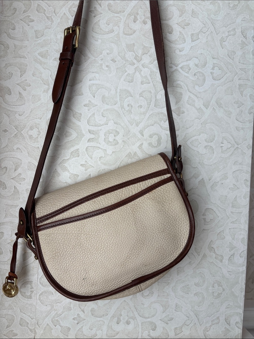 Dooney & Bourke Cream and Brown Pebbled Leather Crossbody Saddle Bag - Picture 3 of 6